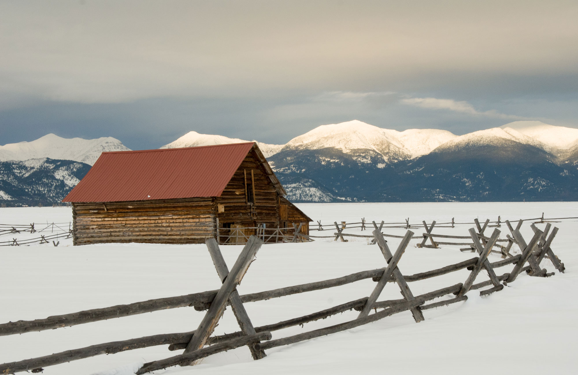 wood barn in the snow